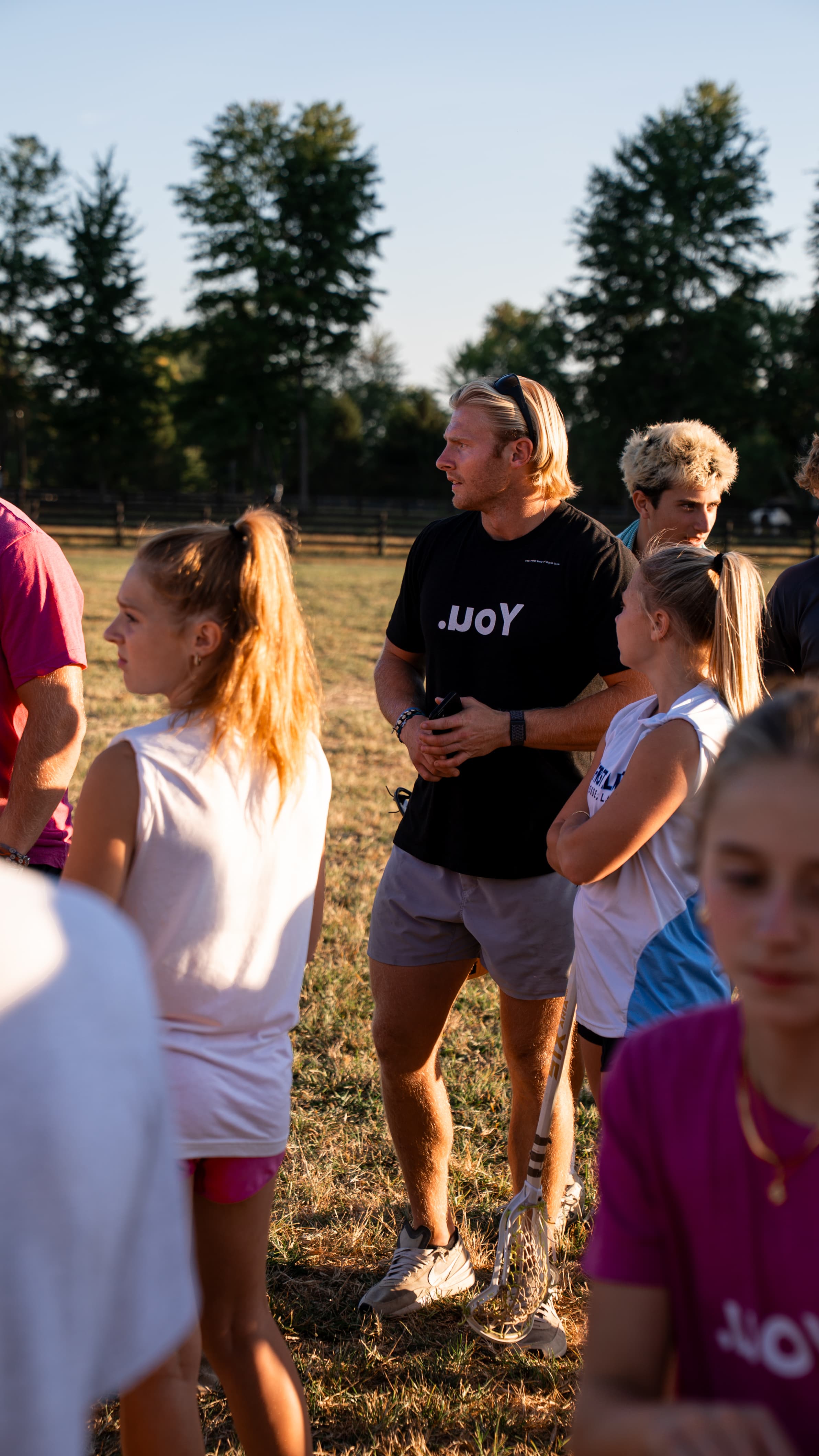 Harrison coaching athletes at golden hour