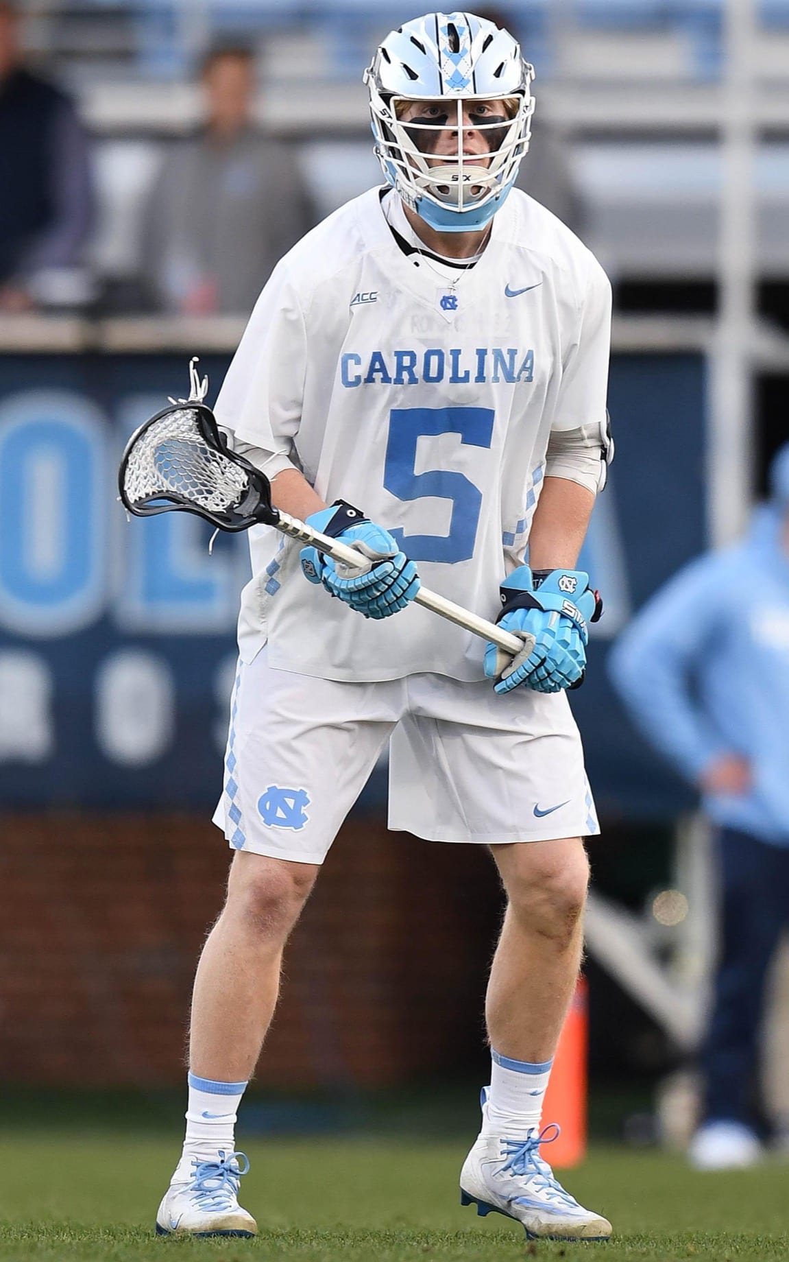 A college lacrosse player mid-game