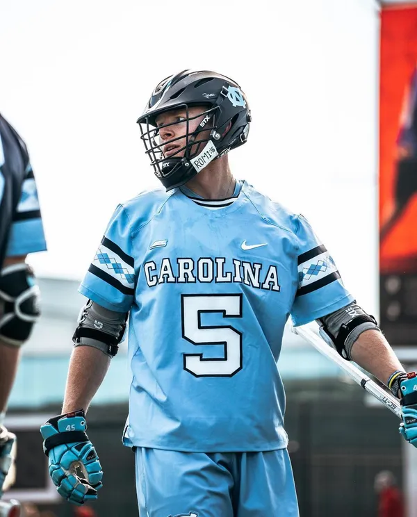 Harrison Schertzinger playing lacrosse for North Carolina